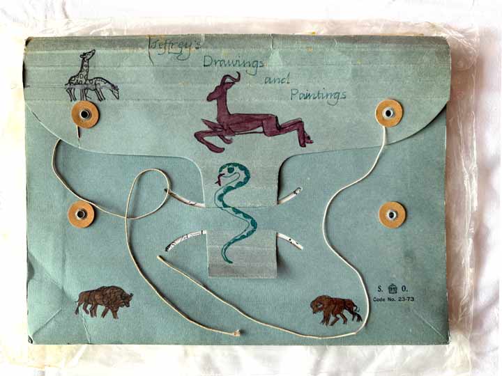 Folder of childhood drawings with animal felt pen illustrations on the cover