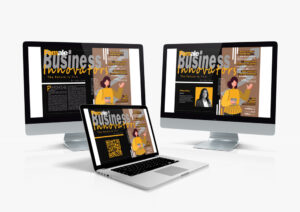 Two Mac monitors and a Macbook showcasing the interactive features of the Female Business Innovators magazine layout